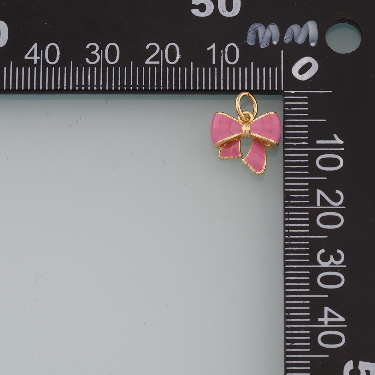 18k Gold Filled Bow Charm + Enamel coloring.