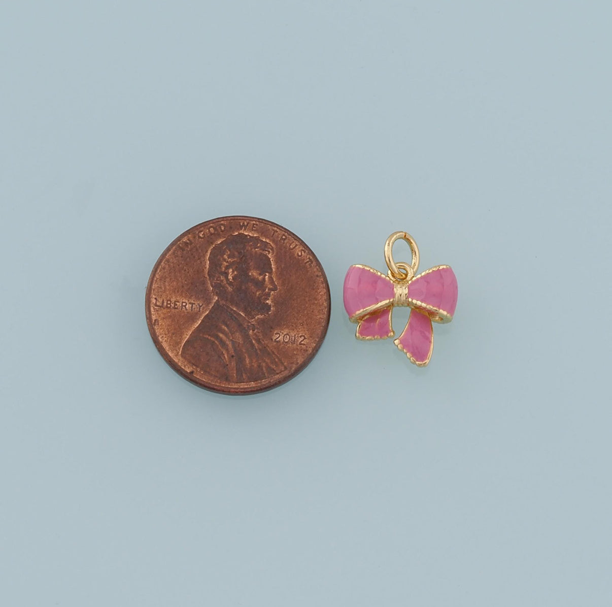 18k Gold Filled Bow Charm + Enamel coloring.