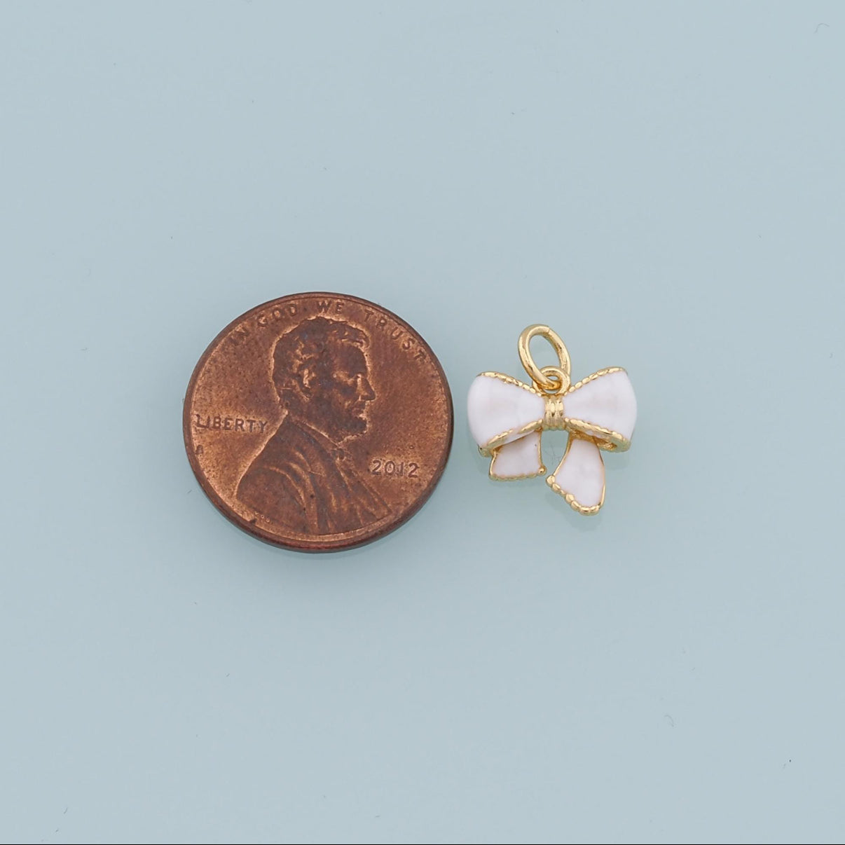 18k Gold Filled Bow Charm + Enamel coloring.